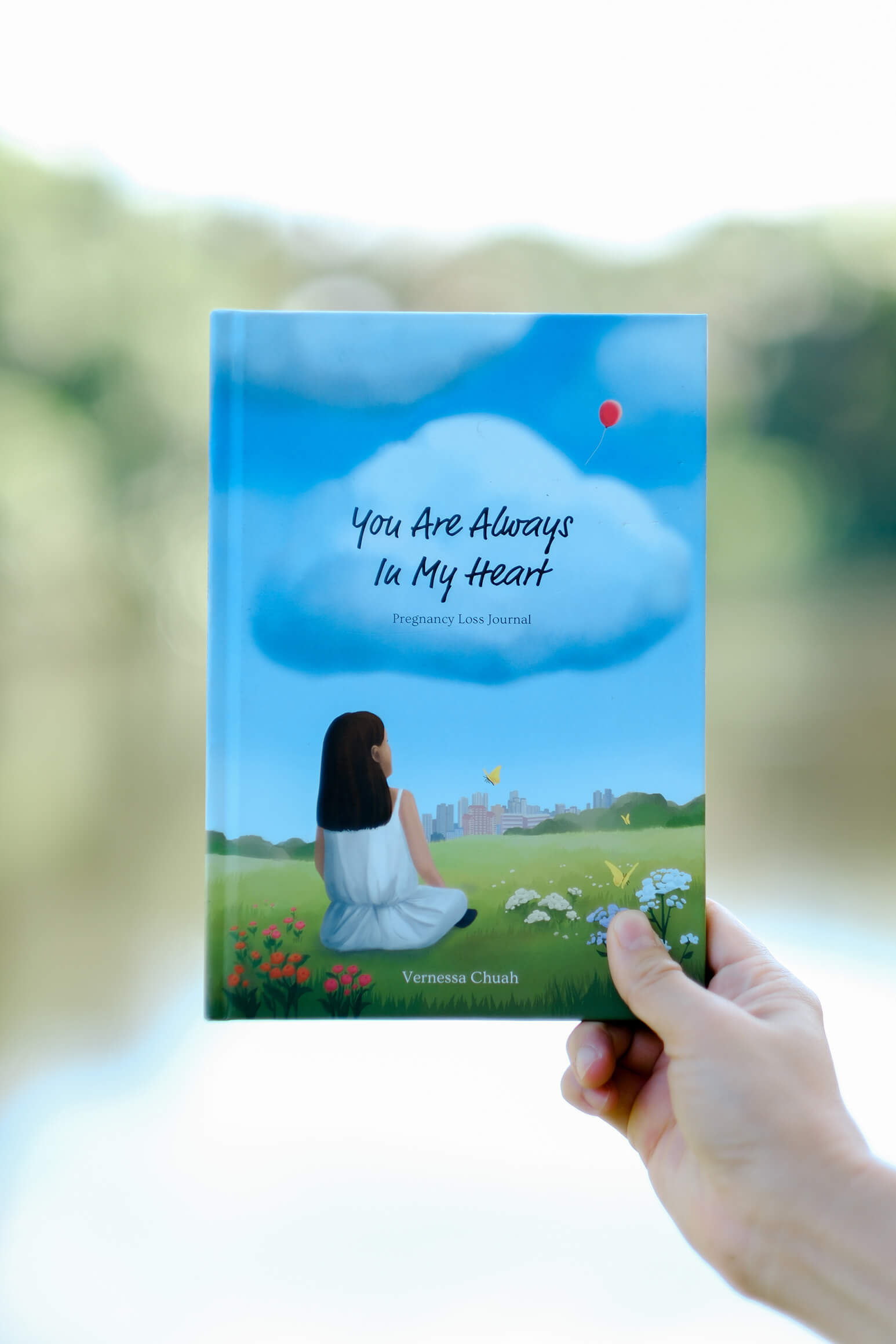 Inside pages of the Pregnancy Loss Journal by Vernessa Chuah — blank spaces for words, drawings, poems and memories