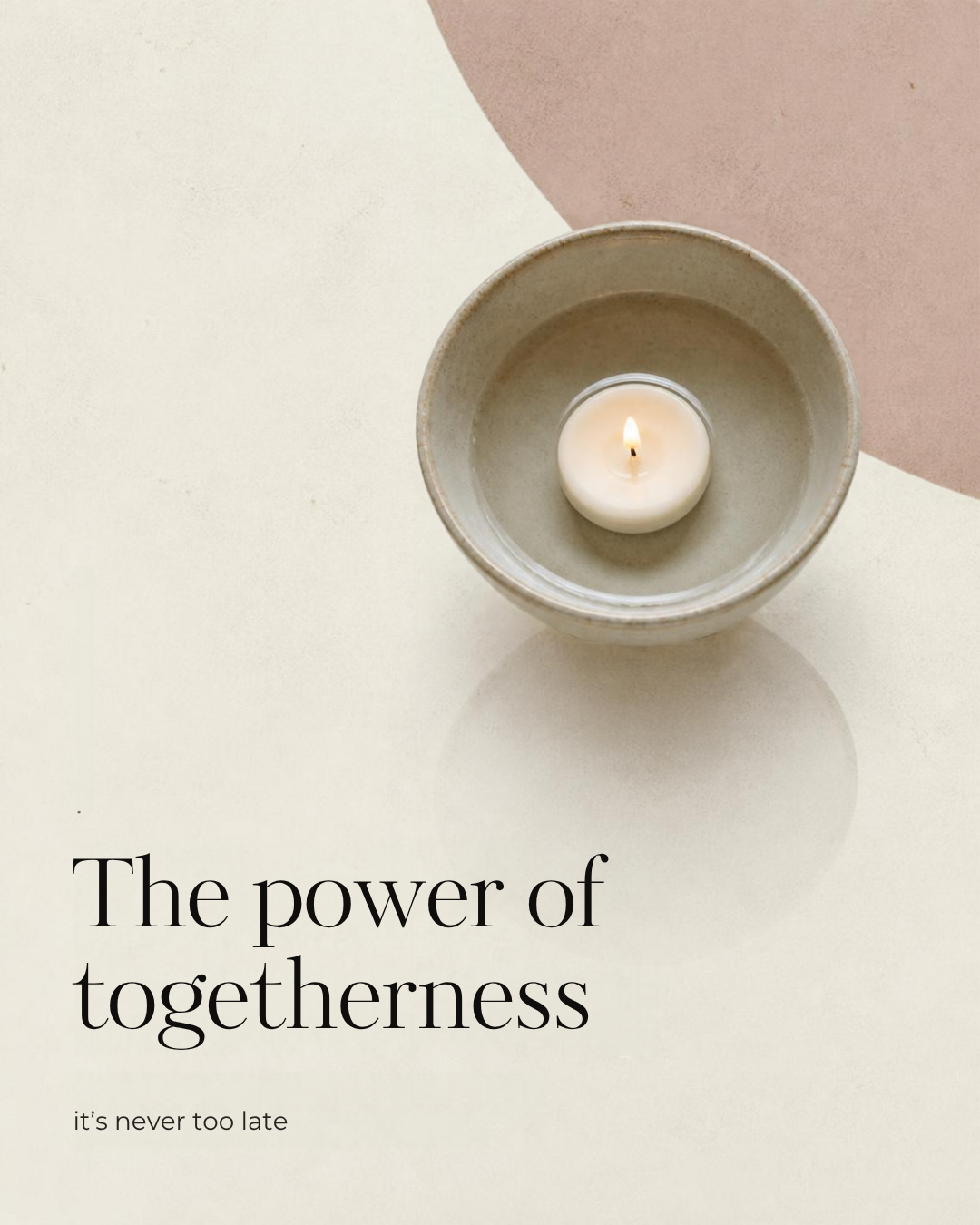 A lit tealight candle in a stone bowl with the words: the power of togetherness, it's never too late